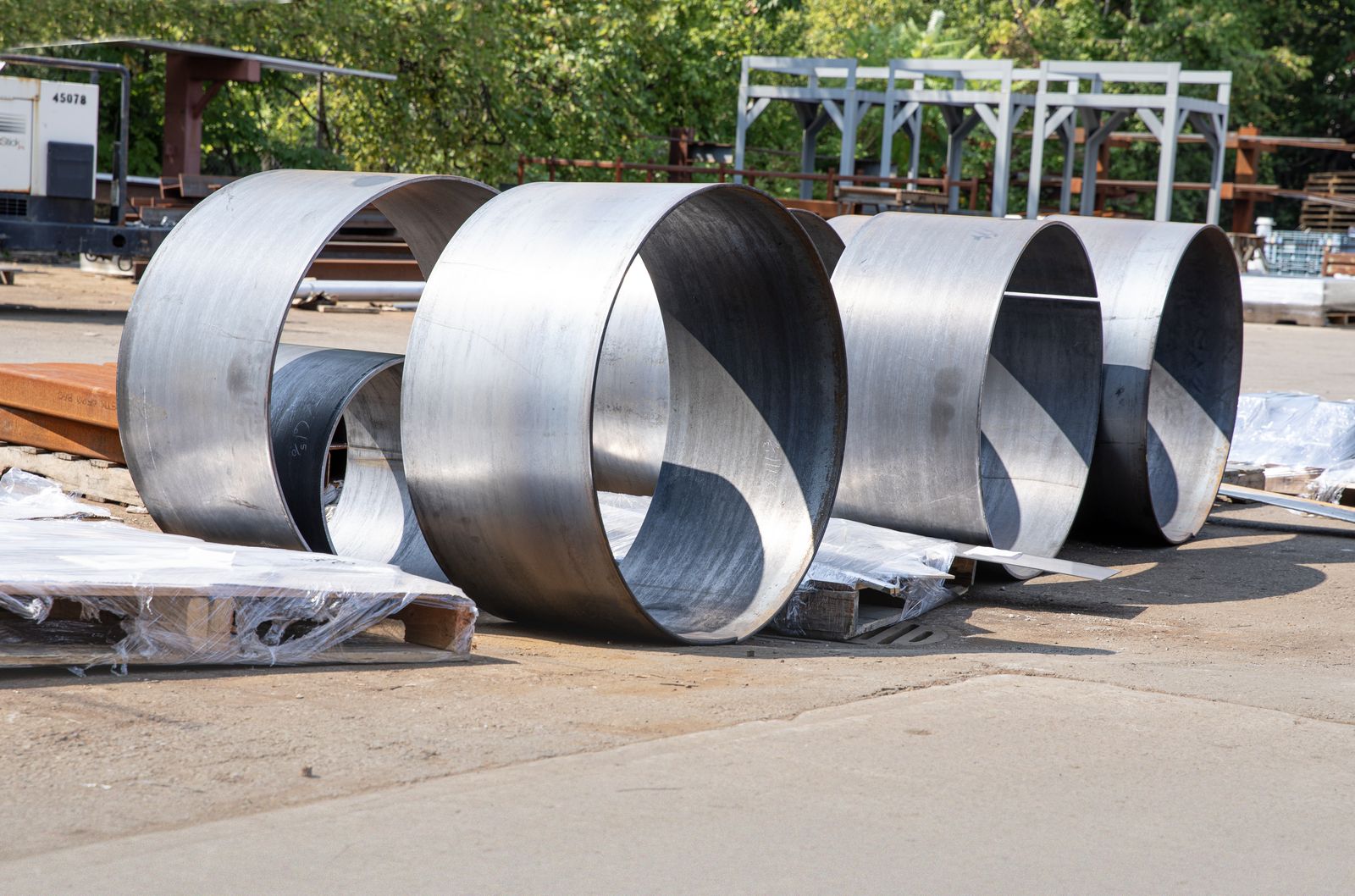 Large rolled steel cylinders, custom fabricated by Dan's Welding & Fabricating in Burlington