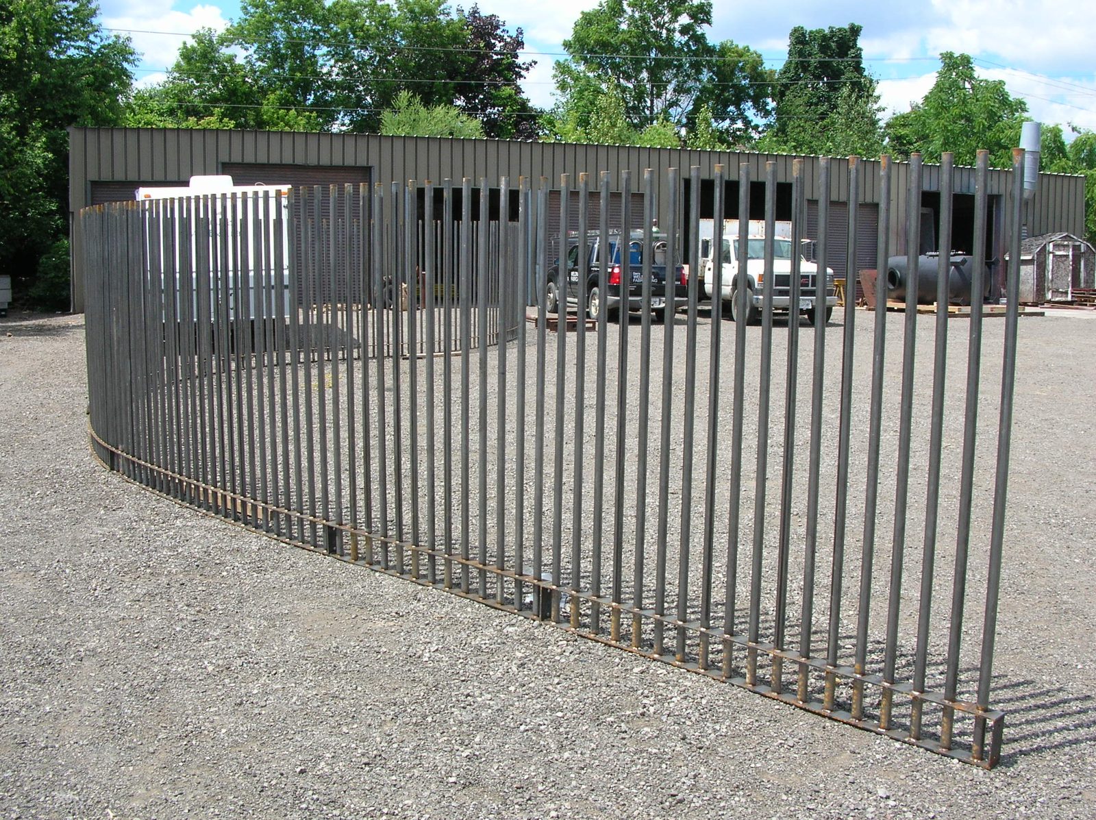 Custom fence set in concrete, custom fabricated by Dan's Welding & Fabricating in Burlington