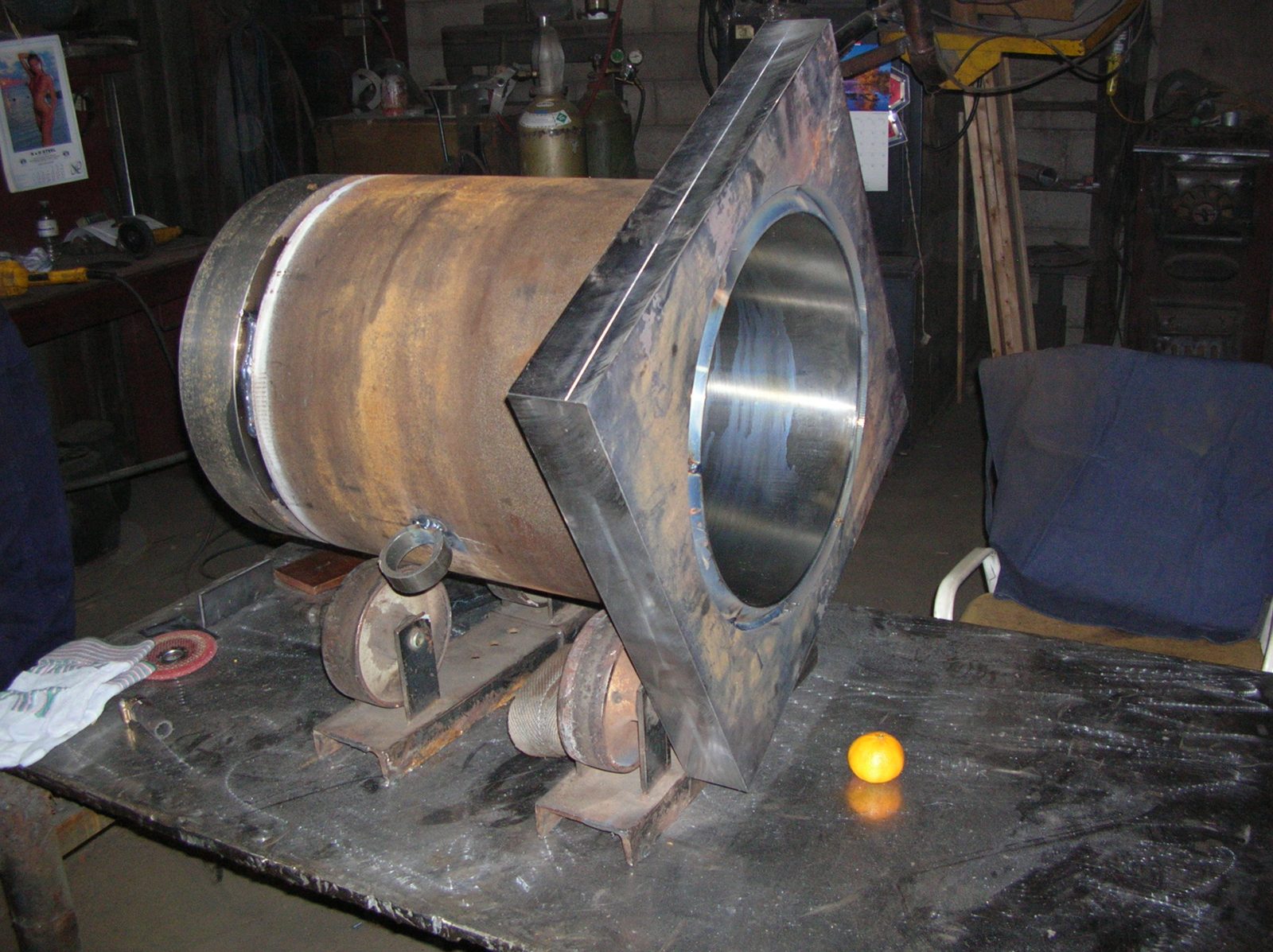 Heavy steel cylinder being fabricated inside the Dan's Welding shop in Burlington, the kind of work a full-service welding shop handles daily